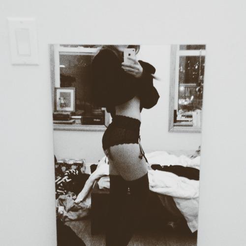 Anonymous in lingerie taking a selfie