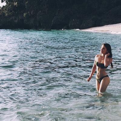 Maria in a bikini taking a selfie