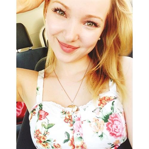 Dove Cameron taking a selfie