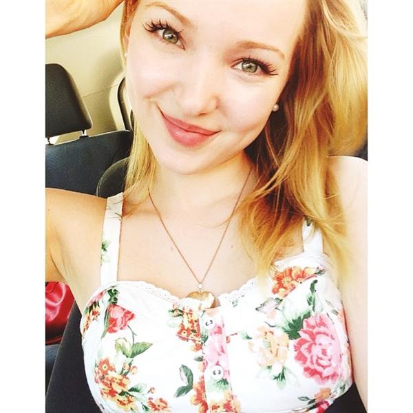 Dove Cameron taking a selfie