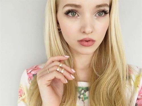 Dove Cameron taking a selfie