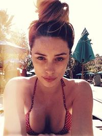 Arielle Vandenberg in a bikini taking a selfie