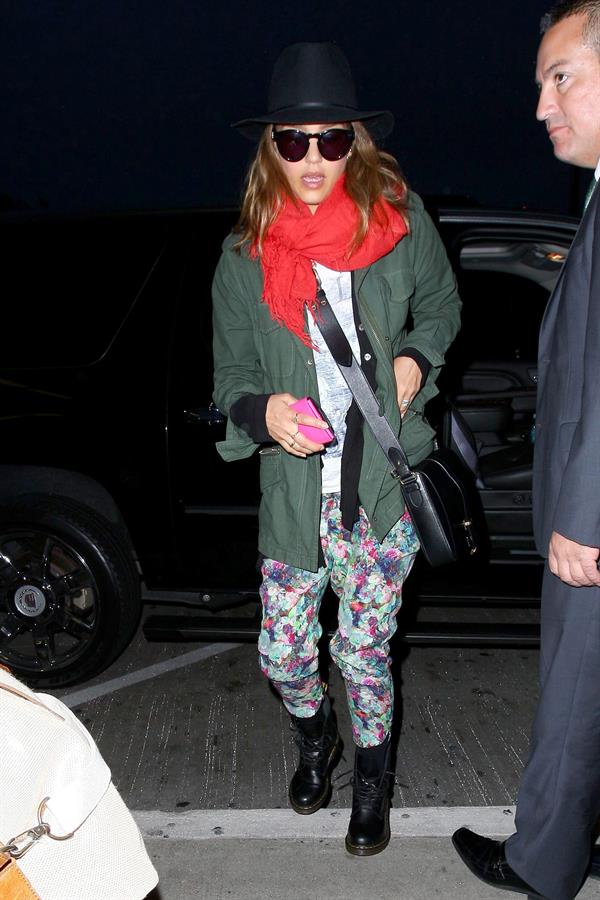 Jessica Alba arrives for an early morning flight at LAX, June 10, 2014
