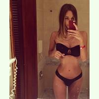 Lily Ermak in a bikini taking a selfie