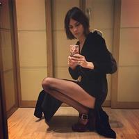 Alexa Chung taking a selfie