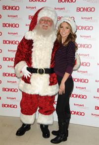 Audrina Patridge poses with Santa Claus