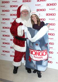 Audrina Patridge poses with Santa Claus