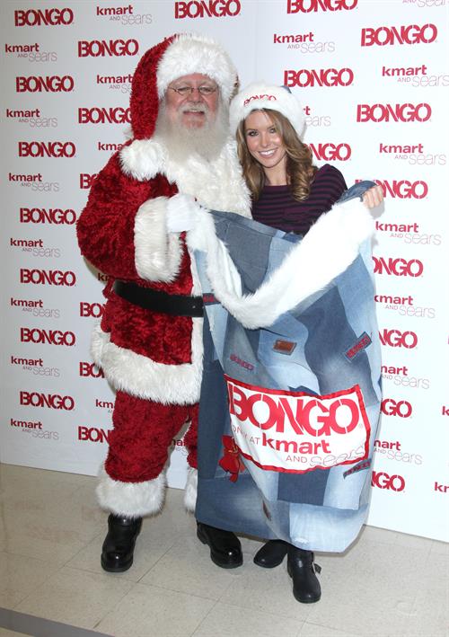 Audrina Patridge poses with Santa Claus