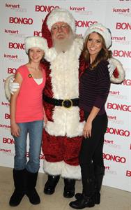 Audrina Patridge poses with Santa Claus