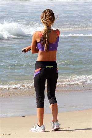 Audrina Patridge running on the beach in the South Bay