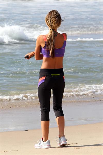 Audrina Patridge running on the beach in the South Bay