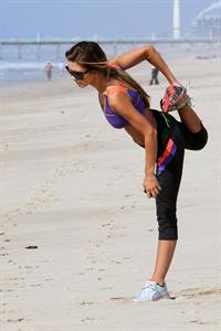 Audrina Patridge running on the beach in the South Bay
