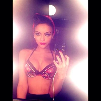 Lisa Ramos in lingerie taking a selfie