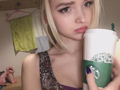 Dove Cameron taking a selfie
