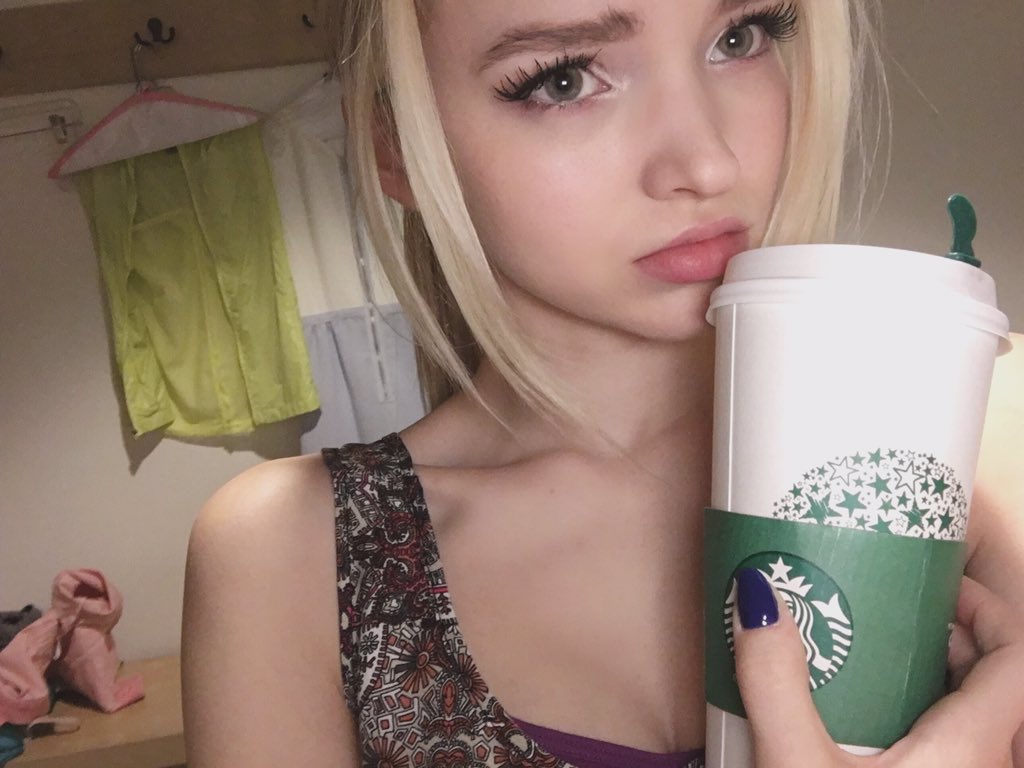 Dove Cameron taking a selfie