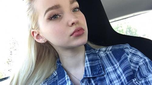 Dove Cameron taking a selfie