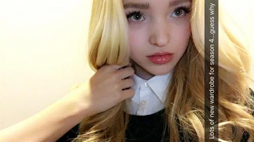 Dove Cameron taking a selfie