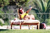 Aida Yespica - Yellow bikini candids in Sardinia on June 18, 2012