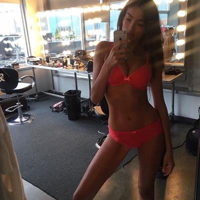Kelly Gale in a bikini taking a selfie