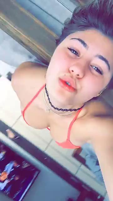 Lia Marie Johnson in a bikini taking a selfie