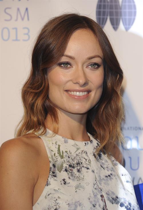 Olivia Wilde debuts her small baby bump while attending the 2013 International Women’s Media Foundation’s Courage in Journalism Awards at the Beverly Hills Hotel on Tuesday (October 29, 2013) in Beverly Hills, Calif.
