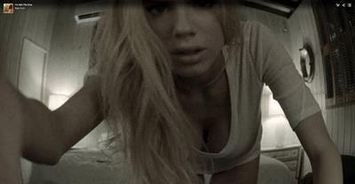 Charlotte McKinney wearing a saucy white t-shirt and brief, giving us a good view of her full arcs and fine torso.