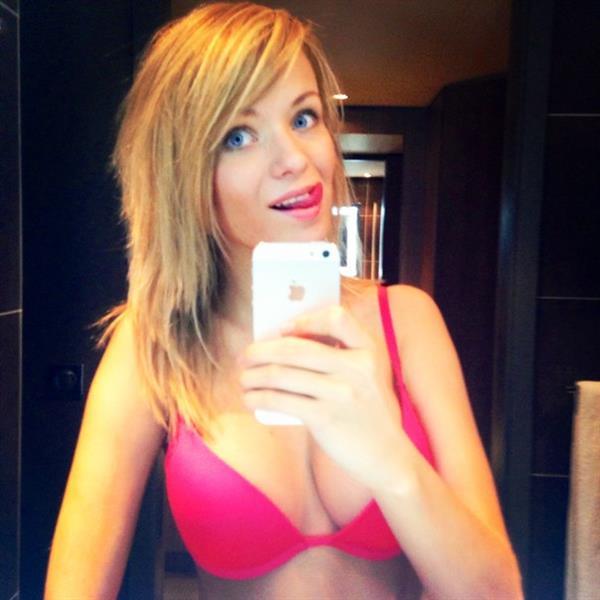 Ekaterina Enokaeva in a bikini taking a selfie