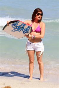 Lucy Hale and Ashley Benson photoshoot at the Bondo Bikini Shack on Miami Beach on March 24, 2012
