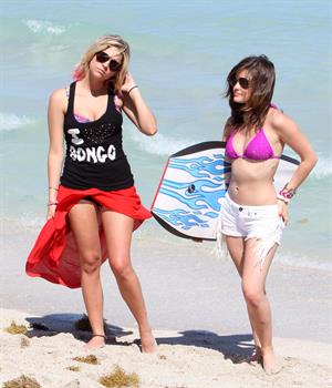 Lucy Hale and Ashley Benson photoshoot at the Bondo Bikini Shack on Miami Beach on March 24, 2012