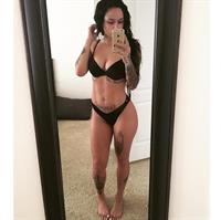 Kehlani in a bikini taking a selfie