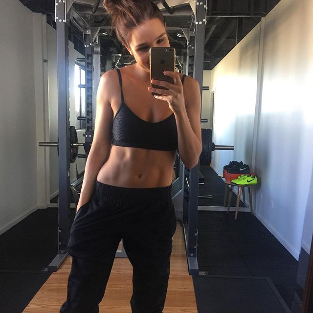Kayla Itsines taking a selfie