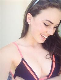 Alexis Young in a bikini taking a selfie