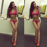 Helga Lovekaty in a bikini taking a selfie