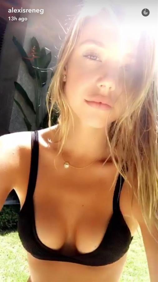 Alexis Ren in a bikini taking a selfie