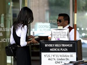 Zoe Saldana stops by an office building in Beverly Hills - January 14, 2012