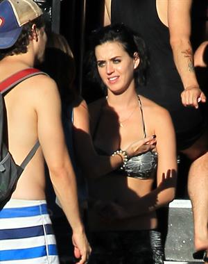 Katy Perry talks with a group of her friends after spending the afternoon at Raging Waters in San Dimas, California on August 12, 2012
