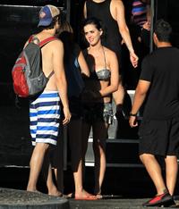 Katy Perry talks with a group of her friends after spending the afternoon at Raging Waters in San Dimas, California on August 12, 2012