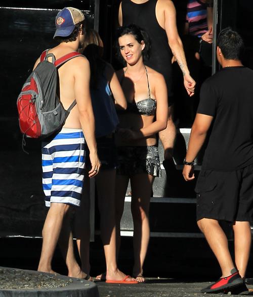 Katy Perry talks with a group of her friends after spending the afternoon at Raging Waters in San Dimas, California on August 12, 2012