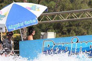 Katy Perry talks with a group of her friends after spending the afternoon at Raging Waters in San Dimas, California on August 12, 2012