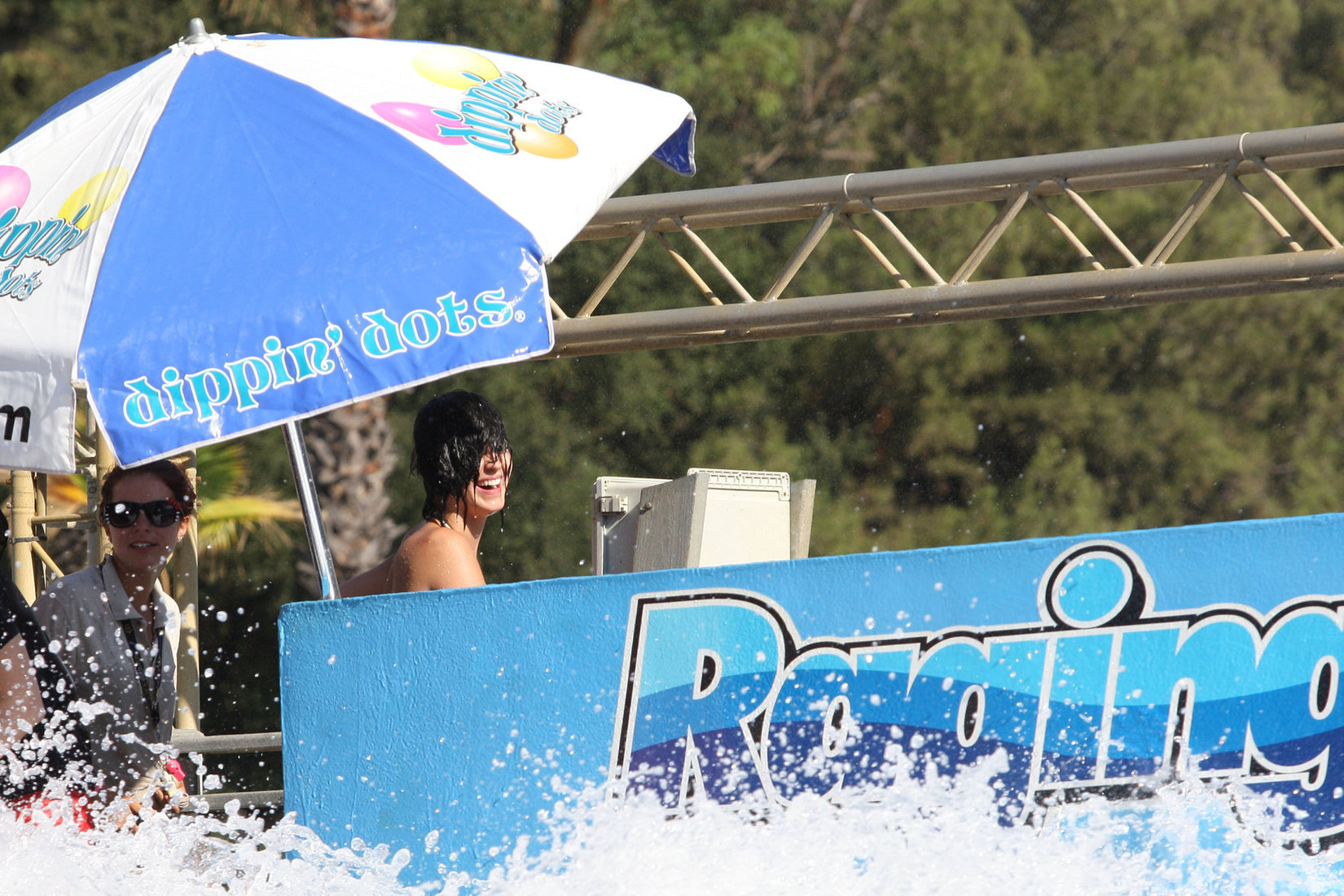 Katy Perry talks with a group of her friends after spending the afternoon at Raging Waters in San Dimas, California on August 12, 2012