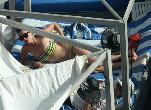 Katy Perry - In a bikini at a hotel pool in Miami July 27, 2012