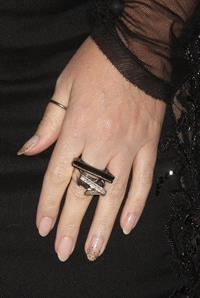 Kylie Minogue in a tight black mini dress for the launching of her book 'Kylie Fashion' at Saks Fifth Avenue