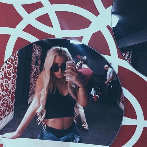 Tana Mongeau taking a selfie