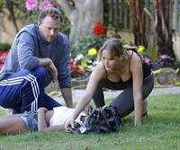 Jennifer Lawrence in Santa Monica helping a woman who fainted on June 25, 2012 