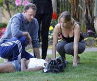 Jennifer Lawrence in Santa Monica helping a woman who fainted on June 25, 2012 