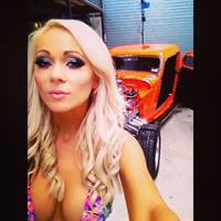 Krystal Dawson in a bikini taking a selfie