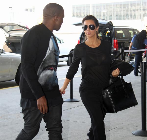 Kim Kardashian and Kanye West JFK airport in New York - 09 August 2012 