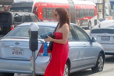 Alyson Hannigan in a red dress in Santa Monica on August 20, 2012