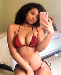 Corie Rayvon in a bikini taking a selfie