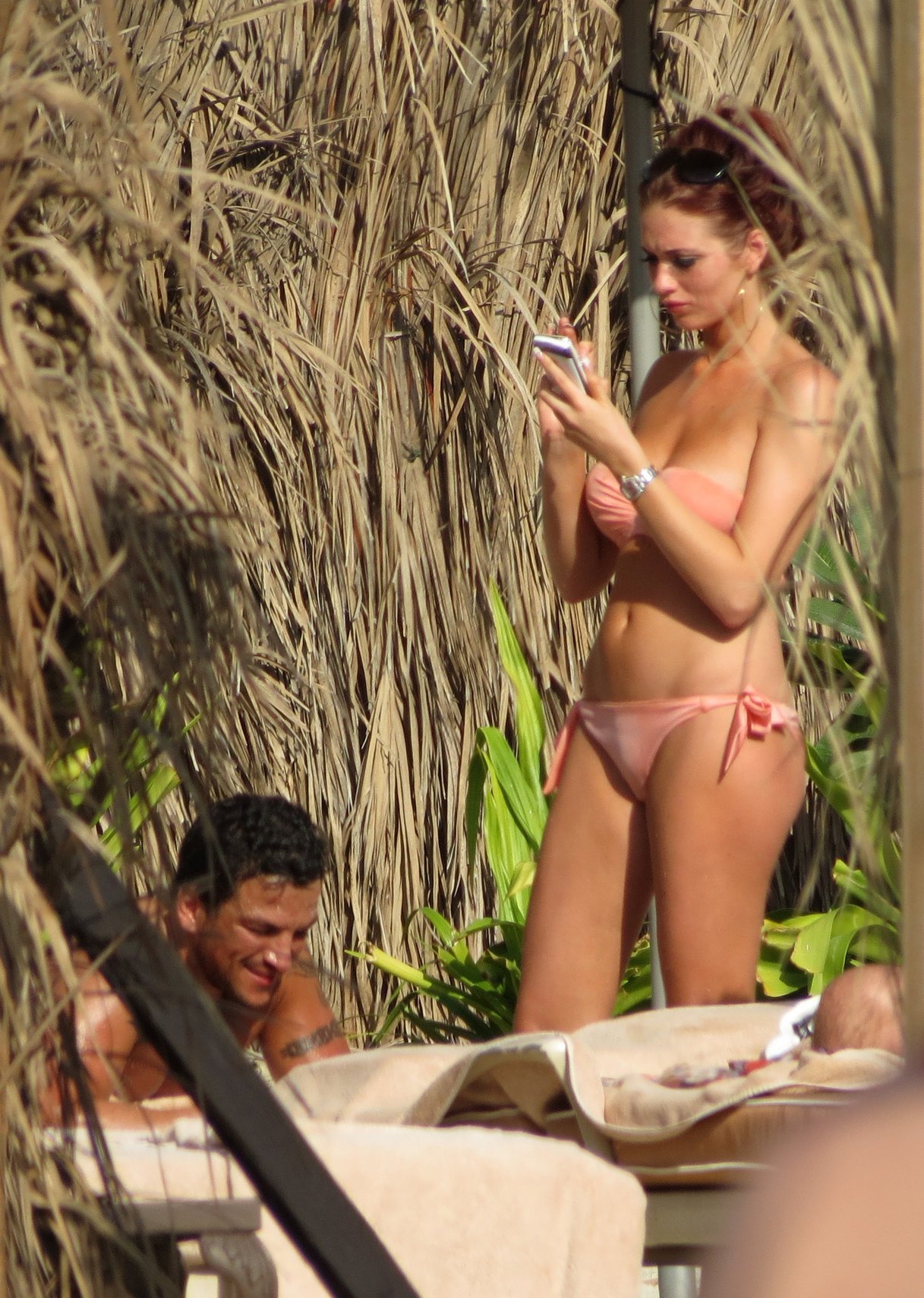 Amy Childs sunbathing with Peter Andre in Dubai on January 3, 2012